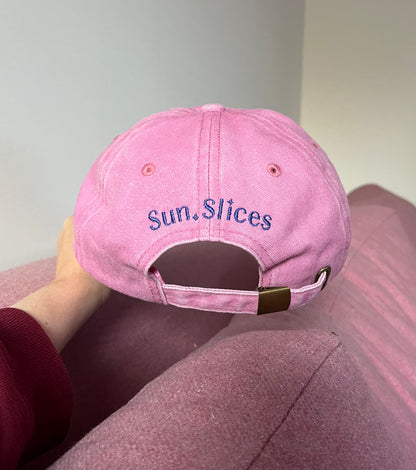 the sunslices cap pictured from the back showing the logo text