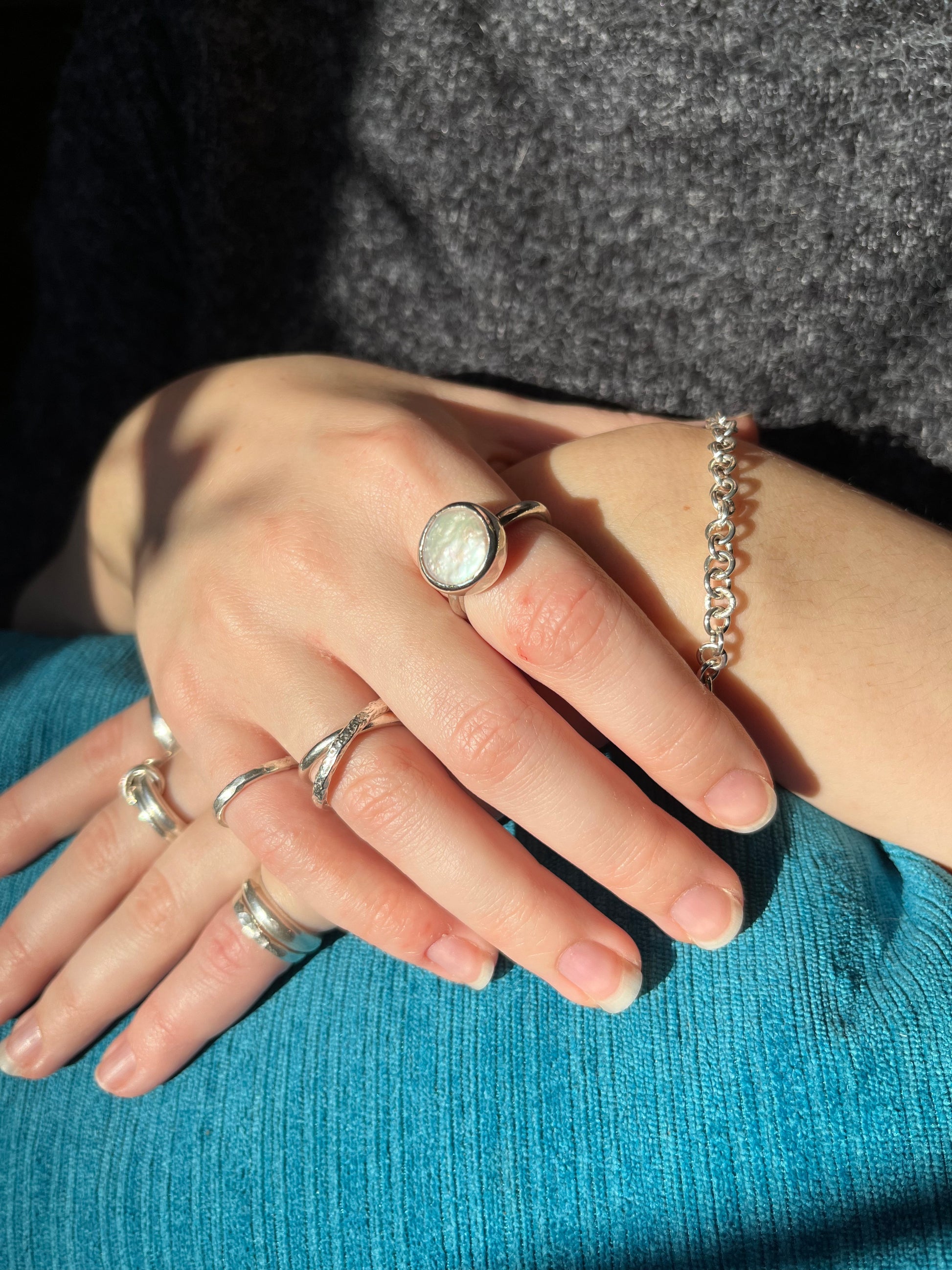 the initial collection of silver pieces including silver stackers, moon rock ring, nova chain.